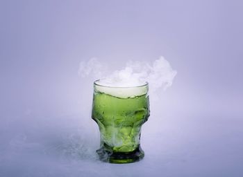 Close-up of drink against white background