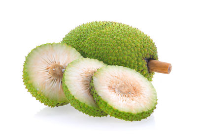 Close-up of fruits over white background