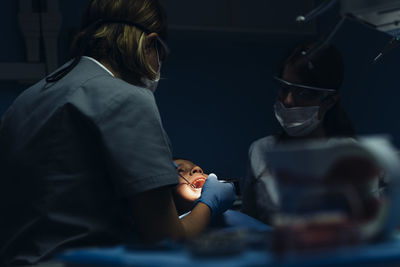 Rear view of woman working