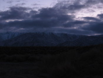 Scenic view of mountain against cloudy sky