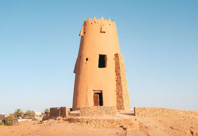 Low angle view of old building against clear sky