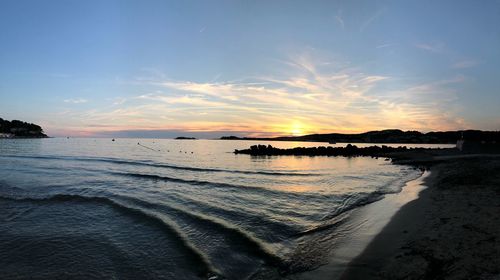 Scenic view of sea against sky during sunset