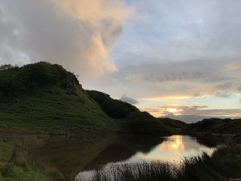 Scenic view of lake against sky during sunset