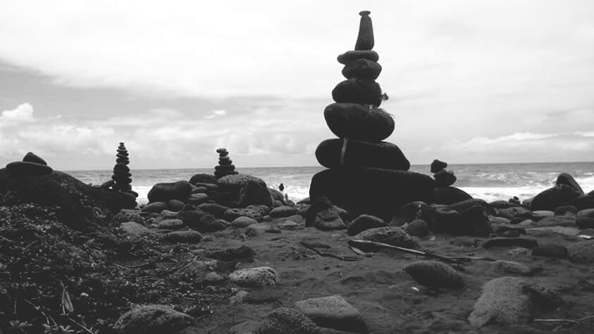 sea, horizon over water, sky, beach, rock - object, water, tranquil scene, tranquility, shore, scenics, nature, beauty in nature, stone - object, cloud - sky, rock formation, stack, rock, pebble, idyllic, cloud