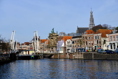 Haarlem, the netherlands. barge passing through the gravestenen drawbridge on spaarne river.