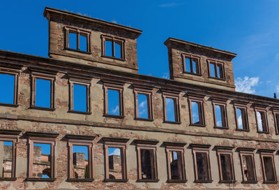 Low angle view of building against blue sky