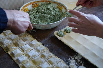 High angle view of man preparing food on table