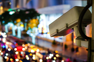 Close-up of security camera at night