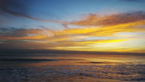 Scenic view of sea at sunset