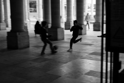 People walking on road in city