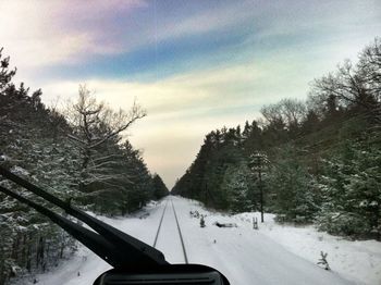 Road seen through train windshield