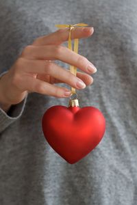 Close-up of woman hand holding heart shape