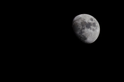 Low angle view of moon against clear sky at night