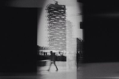 Woman standing in front of building