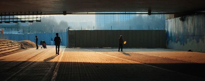 People below bridge