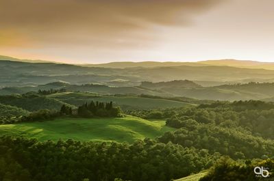 Scenic view of landscape against sky during sunset