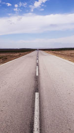 Empty road along landscape