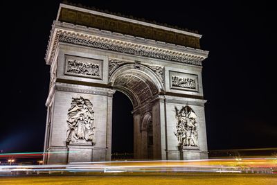 Low angle view of statue at night