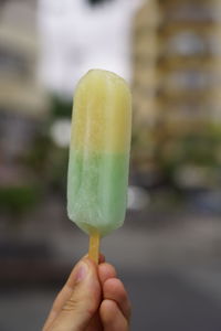 Close-up of hand holding ice cream