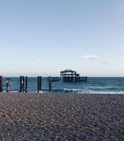Pier over sea against sky