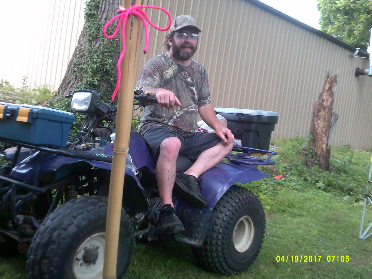 FULL LENGTH OF HAPPY MAN SITTING ON MOTORCYCLE