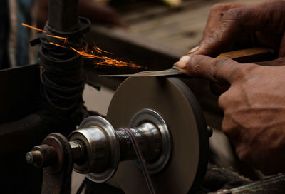 Cropped hand sharpening knife