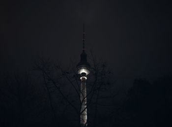 Low angle view of communications tower against sky