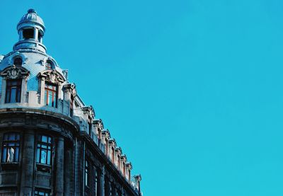 Low angle view of built structure against blue sky