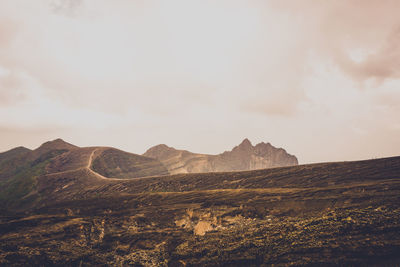 Scenic view of rocky mountains against sky