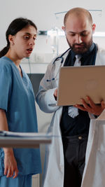 Doctor talking with patient in hospital