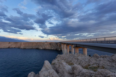 Bridge over sea against sky