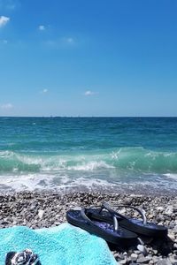 Scenic view of sea against clear blue sky