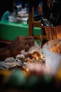 Midsection of person preparing food