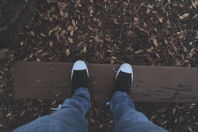 Low section of man standing on floor