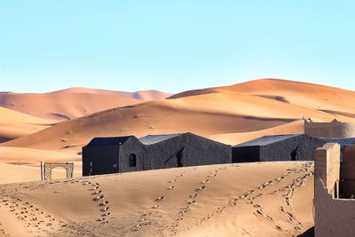 View of desert against clear blue sky