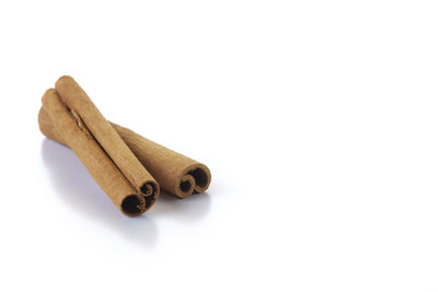 High angle view of coffee beans against white background