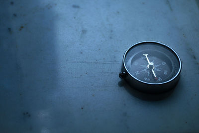 Close-up of compass on table