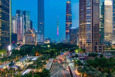 Panoramic view of city street and buildings against sky