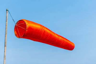 Low angle view of boat against clear blue sky