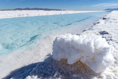 Scenic view of sea during winter against sky