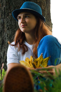 Portrait of beautiful young woman looking away
