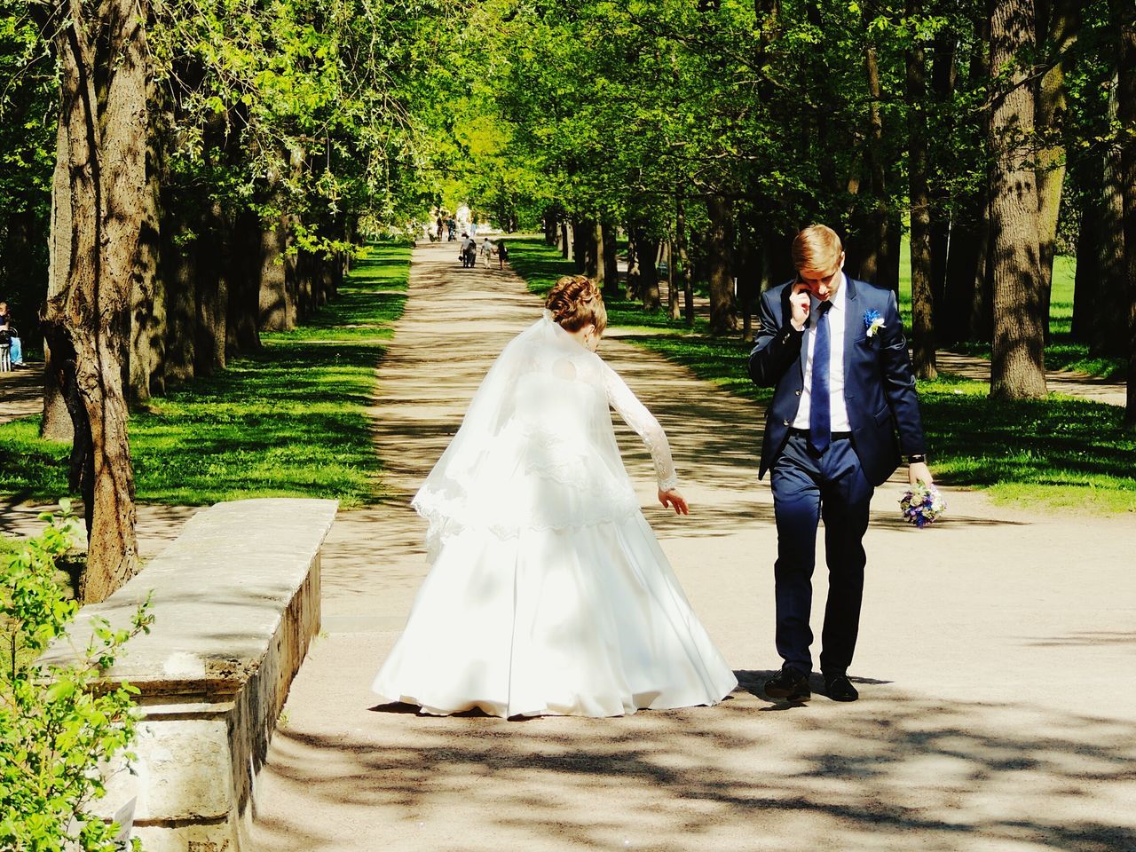 tree, park - man made space, full length, lifestyles, leisure activity, tree trunk, person, rear view, growth, casual clothing, the way forward, park, walking, standing, footpath, day, outdoors, branch