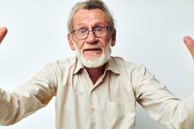 Portrait of young man against white background