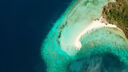Aerial view tropical beach on island ditaytayan. tropical island with white sand bar