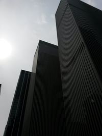 Low angle view of office building against sky