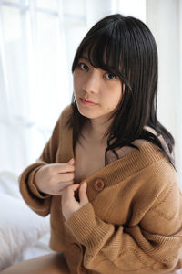 Close-up of young woman looking away