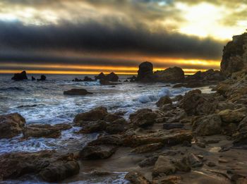 Scenic view of sea against cloudy sky