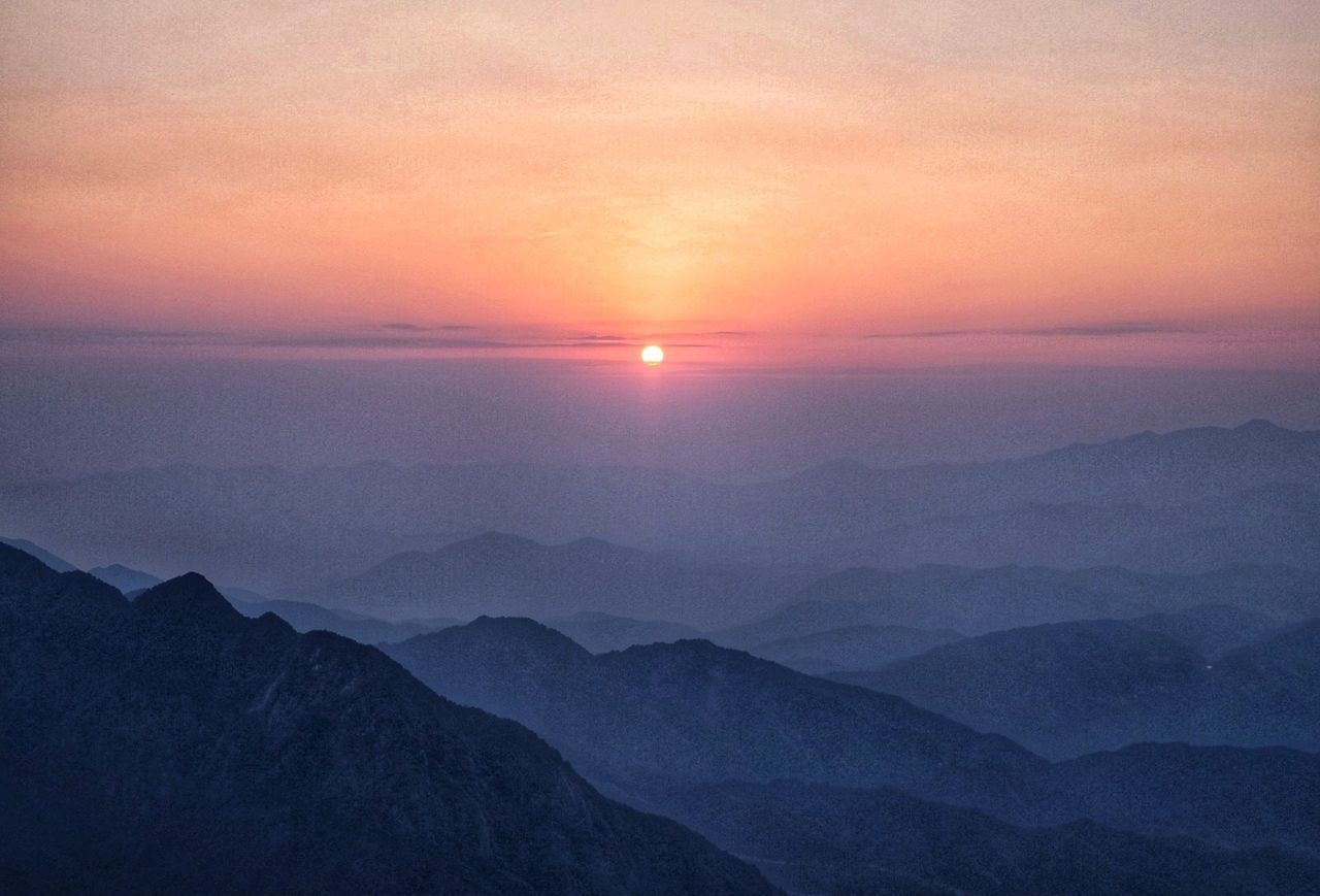 SCENIC VIEW OF MOUNTAINS AGAINST ROMANTIC SKY