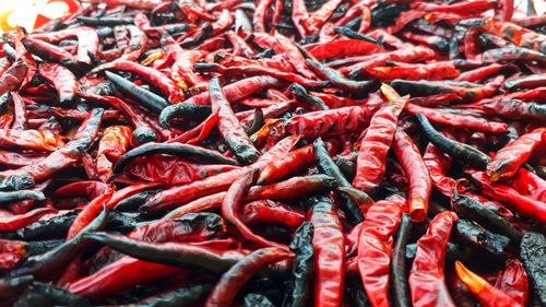 Full frame shot of red chili peppers for sale at market