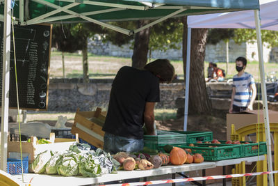 People at market stall